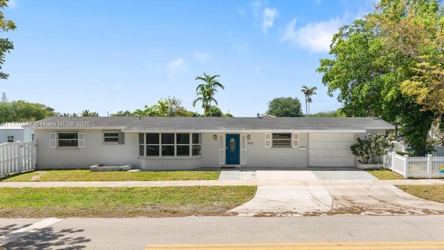 820 W Chaminade Dr, Hollywood, FL 33021 - ranch-style house with an attached garage, driveway, stucco siding, and fence