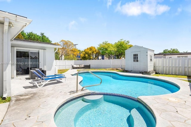 820 W Chaminade Dr, Hollywood, FL 33021 - view of pool with a shed, a patio area, a pool with connected hot tub, a fenced backyard, and an outdoor structure