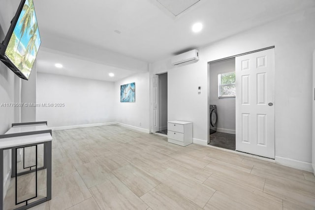 820 W Chaminade Dr, Hollywood, FL 33021 - basement with recessed lighting, washer / dryer, baseboards, and a wall unit AC