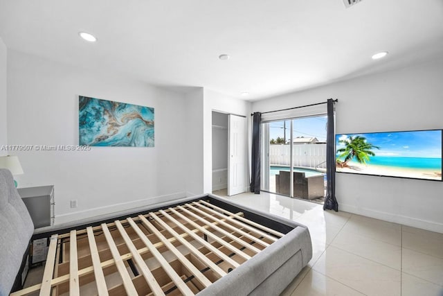 820 W Chaminade Dr, Hollywood, FL 33021 - unfurnished bedroom with tile patterned floors, a closet, baseboards, and recessed lighting