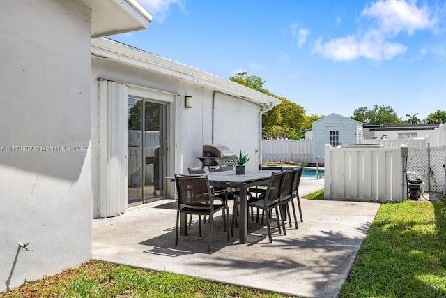 820 W Chaminade Dr, Hollywood, FL 33021 - view of patio featuring fence, a fenced in pool, outdoor dining area, and area for grilling