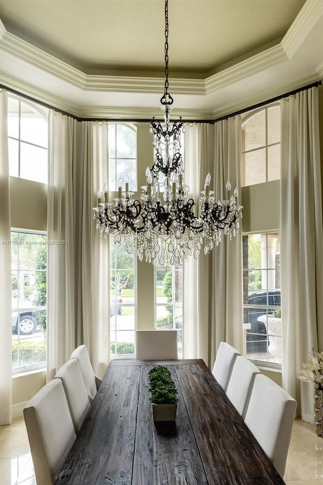 5025 Regency Isles Way, Cooper City, FL 33330 - dining area featuring a chandelier, a raised ceiling, and ornamental molding