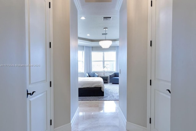 5025 Regency Isles Way, Cooper City, FL 33330 - corridor featuring baseboards, ornamental molding, a tray ceiling, and visible vents