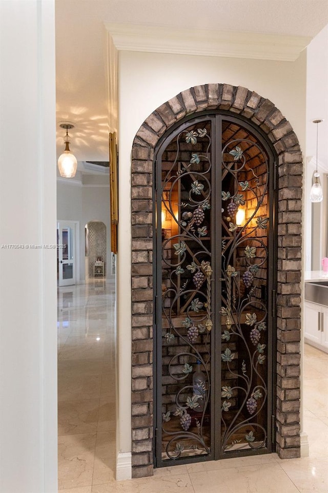 5025 Regency Isles Way, Cooper City, FL 33330 - wine area with arched walkways and crown molding