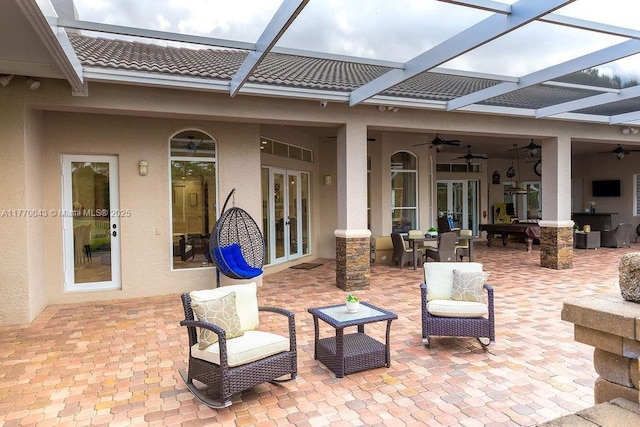 5025 Regency Isles Way, Cooper City, FL 33330 - view of patio with outdoor lounge area, a lanai, a ceiling fan, and french doors
