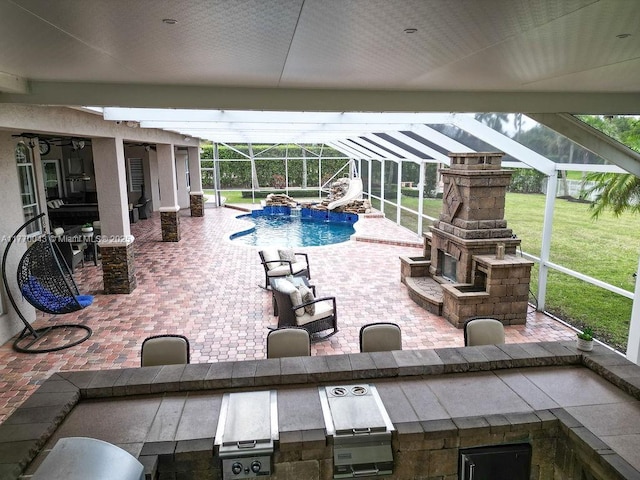 5025 Regency Isles Way, Cooper City, FL 33330 - pool with a water slide, an outdoor fireplace, a yard, a patio area, and a lanai