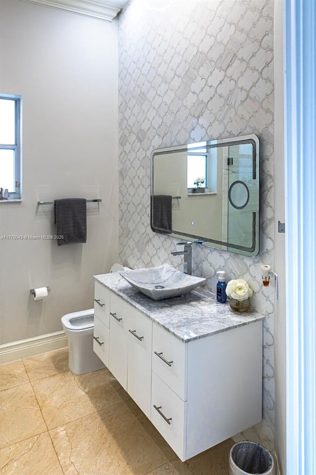 5025 Regency Isles Way, Cooper City, FL 33330 - bathroom with baseboards, a healthy amount of sunlight, toilet, and vanity