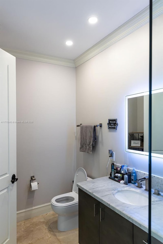 5025 Regency Isles Way, Cooper City, FL 33330 - half bath with crown molding, vanity, marble finish floor, baseboards, and toilet