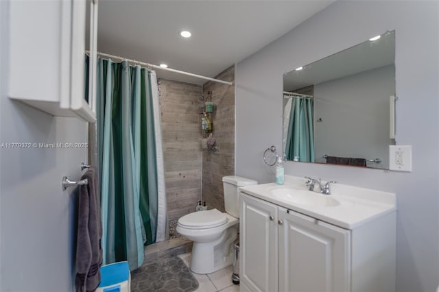 bathroom featuring a tile shower, vanity, toilet, tile patterned floors, and recessed lighting