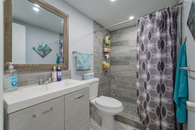 full bath featuring recessed lighting, vanity, toilet, and tiled shower