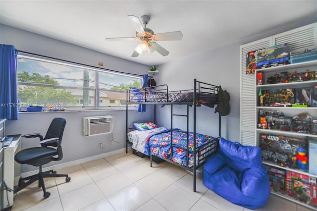 tiled bedroom featuring ceiling fan, a wall mounted AC, and baseboards