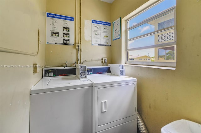 community laundry room with separate washer and dryer