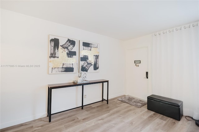 10300 NW 80th Ct, Tamarac, FL 33321 - empty room with light wood-type flooring and baseboards