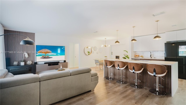 10300 NW 80th Ct, Tamarac, FL 33321 - living room with light wood-style flooring