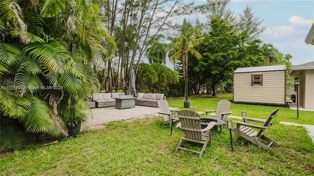 10300 NW 80th Ct, Tamarac, FL 33321 - view of green lawn featuring an outdoor living space with a fire pit and a patio area