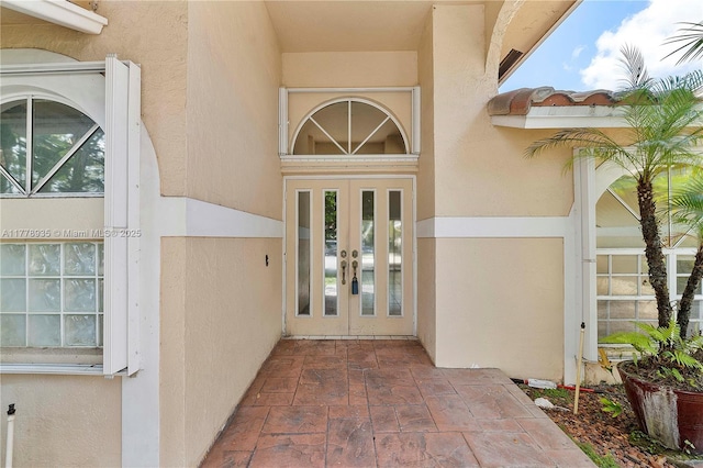 4622 NW 100th Ter, Coral Springs, FL 33076 - doorway to property featuring french doors and stucco siding