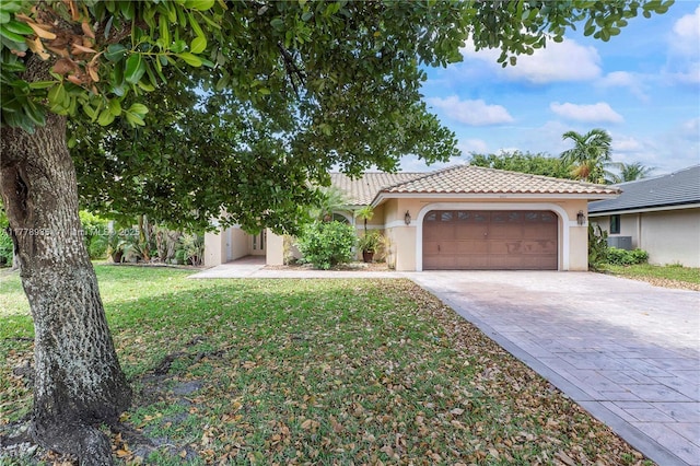4622 NW 100th Ter, Coral Springs, FL 33076 - view of front of home with a garage, stucco siding, decorative driveway, and a tile roof