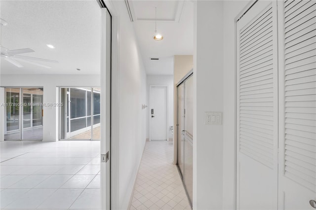 4622 NW 100th Ter, Coral Springs, FL 33076 - hallway featuring light tile patterned flooring, attic access, and recessed lighting