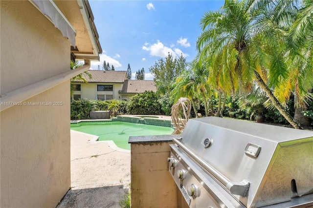 4622 NW 100th Ter, Coral Springs, FL 33076 - view of patio with a pool with connected hot tub and exterior kitchen