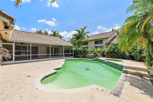 4622 NW 100th Ter, Coral Springs, FL 33076 - view of pool featuring a sunroom, ceiling fan, a patio, and a pool with connected hot tub
