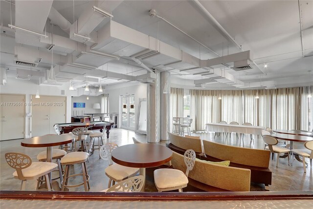 10 SW S River Dr Unit 610, Miami, FL 33130 - dining area featuring finished concrete flooring