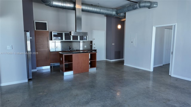10 SW S River Dr Unit 610, Miami, FL 33130 - kitchen with open shelves, concrete floors, a high ceiling, baseboards, and wall chimney exhaust hood