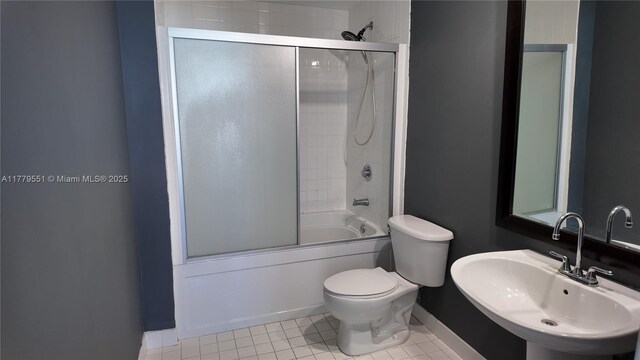 10 SW S River Dr Unit 610, Miami, FL 33130 - bathroom with a sink, baseboards, enclosed tub / shower combo, toilet, and tile patterned flooring