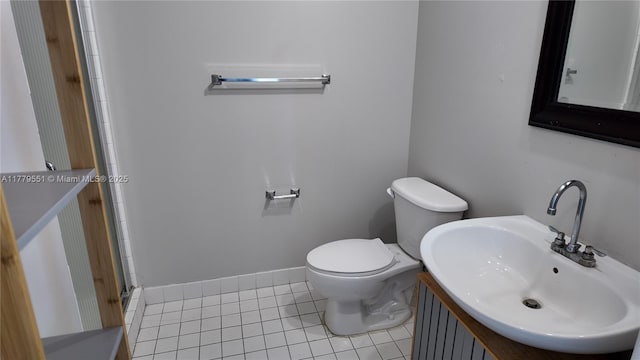 10 SW S River Dr Unit 610, Miami, FL 33130 - bathroom featuring tile patterned floors, toilet, a stall shower, baseboards, and vanity