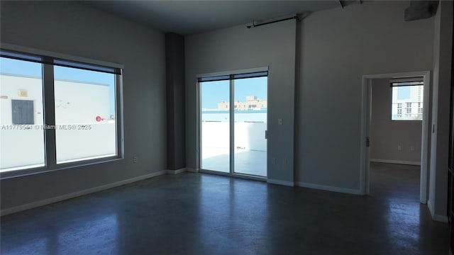 10 SW S River Dr Unit 610, Miami, FL 33130 - empty room with concrete floors and baseboards
