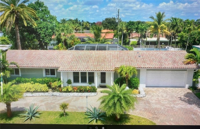 428 N Crescent Dr, Hollywood, FL 33021 - rear view of house with a tile roof, stucco siding, and a garage