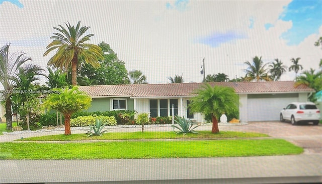 428 N Crescent Dr, Hollywood, FL 33021 - single story home featuring a tiled roof, asphalt driveway, stucco siding, a front yard, and a garage