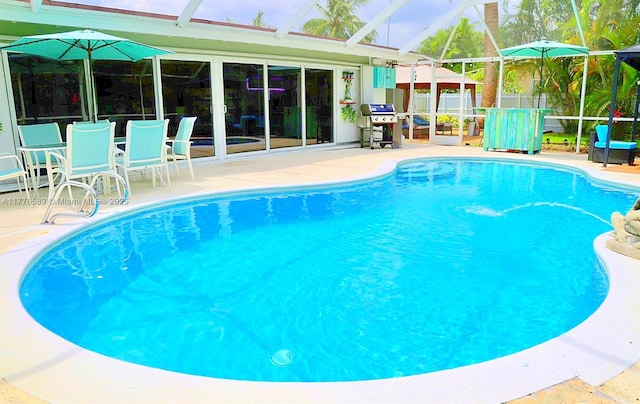 428 N Crescent Dr, Hollywood, FL 33021 - outdoor pool featuring a patio area, a lanai, a grill, and fence
