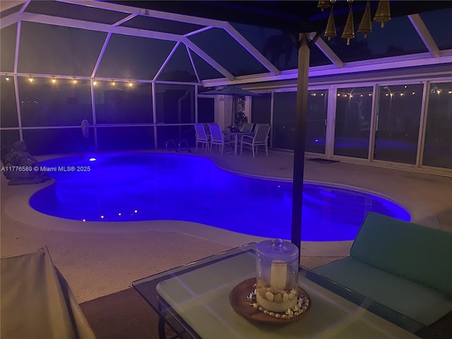 428 N Crescent Dr, Hollywood, FL 33021 - pool at twilight with a patio, glass enclosure, and an outdoor pool
