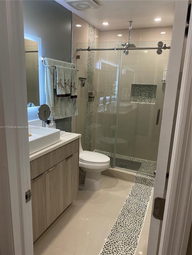 428 N Crescent Dr, Hollywood, FL 33021 - full bathroom with a stall shower, vanity, toilet, and tile patterned floors