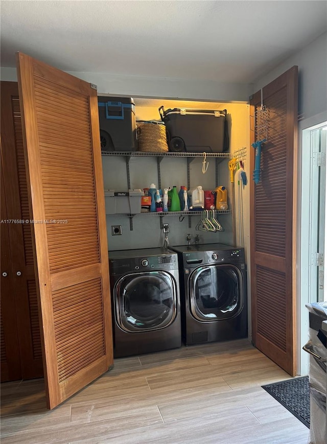 428 N Crescent Dr, Hollywood, FL 33021 - clothes washing area with wood finished floors and washing machine and clothes dryer