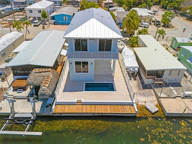 drone / aerial view featuring a residential view and a water view