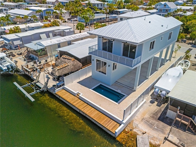 birds eye view of property featuring a residential view and a water view