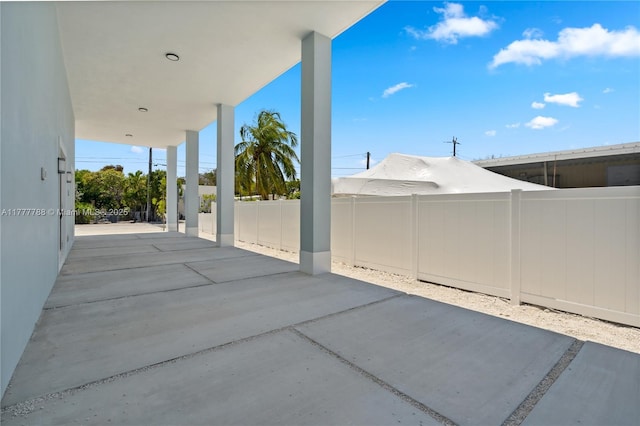 view of patio / terrace featuring fence