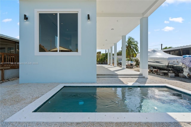 view of swimming pool featuring a patio and a fenced in pool
