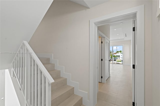 stairway featuring recessed lighting and baseboards
