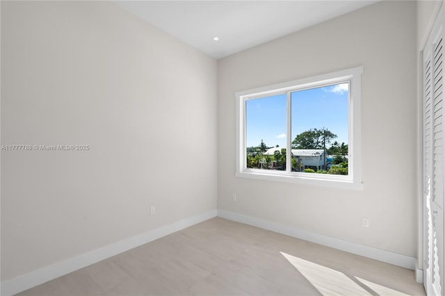 empty room with baseboards