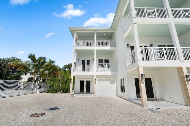 84745 Old Hwy Unit 1, Islamorada, FL 33036 - back of house featuring french doors and an attached garage
