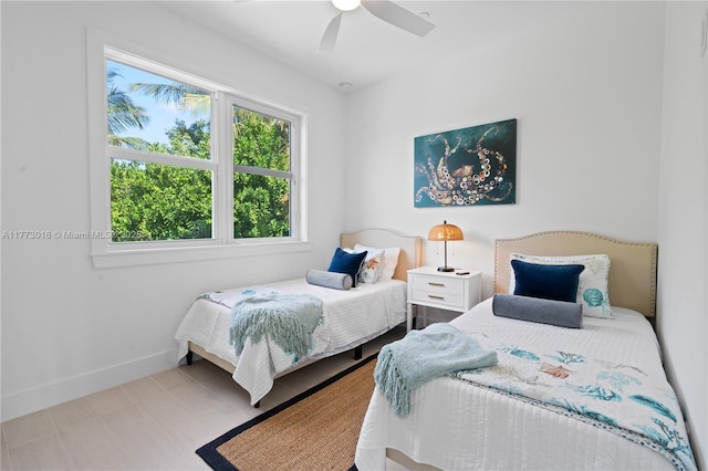 84745 Old Hwy Unit 1, Islamorada, FL 33036 - bedroom with multiple windows and a ceiling fan