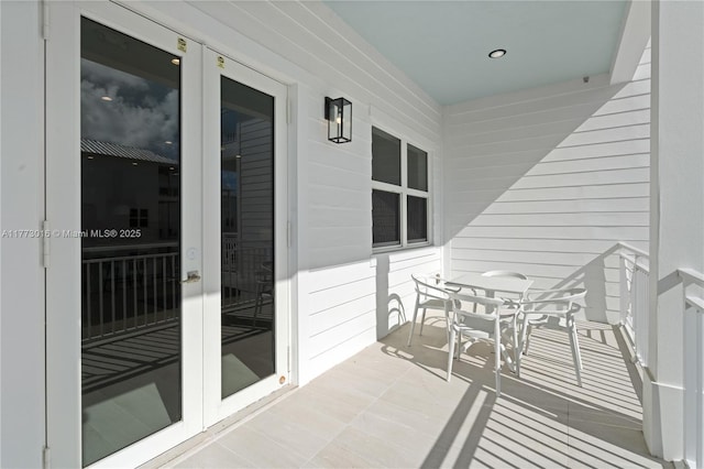 84745 Old Hwy Unit 1, Islamorada, FL 33036 - balcony featuring french doors and outdoor dining space
