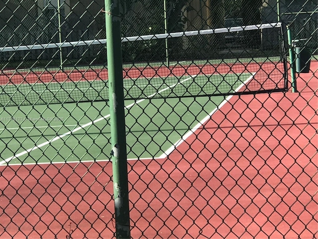 5112 NW 79th Ave Unit 201, Doral, FL 33166 - view of tennis court featuring fence