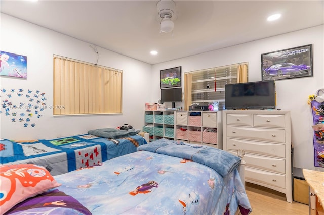 bedroom featuring recessed lighting, light wood-style flooring, and a ceiling fan