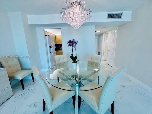 18071 Biscayne Blvd Unit 1503, Aventura, FL 33160 - dining area featuring light marble finish flooring, baseboards, and a chandelier