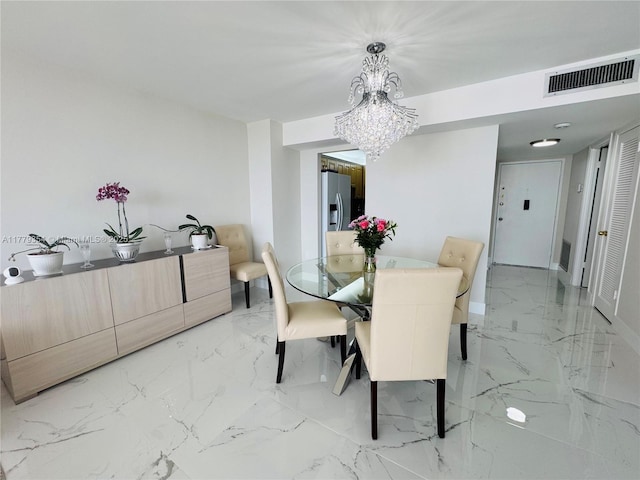 18071 Biscayne Blvd Unit 1503, Aventura, FL 33160 - dining space with light marble finish floors, a chandelier, and baseboards