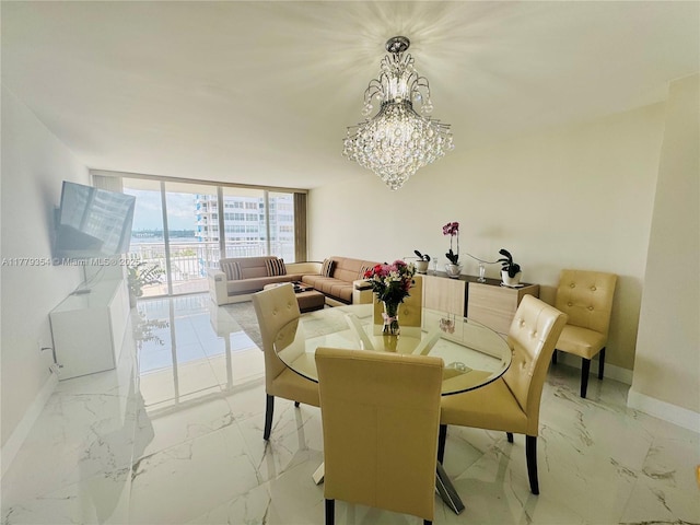 18071 Biscayne Blvd Unit 1503, Aventura, FL 33160 - dining area with baseboards, floor to ceiling windows, a chandelier, and light marble finish flooring