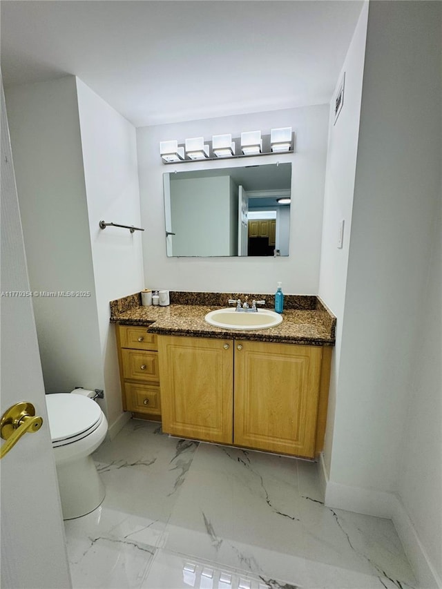 18071 Biscayne Blvd Unit 1503, Aventura, FL 33160 - half bathroom featuring marble finish floors, baseboards, vanity, and toilet